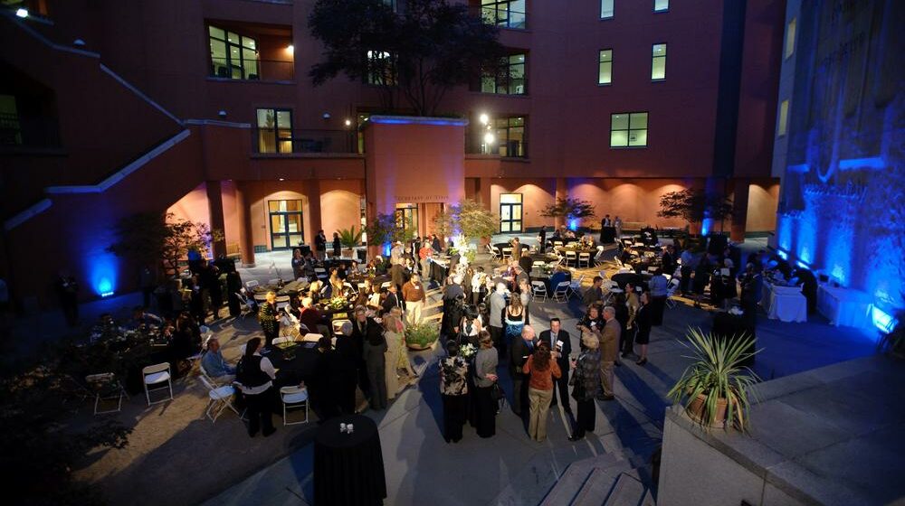 A night time corporate event in the museum courtyard.