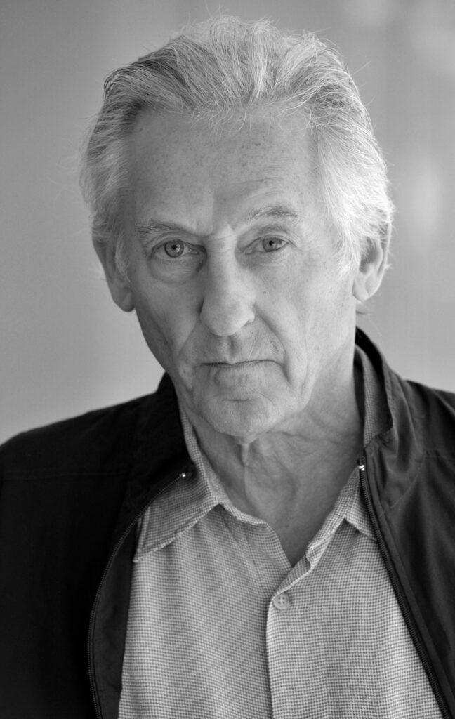 Headshot of Ed Ruscha with a serious expression.
