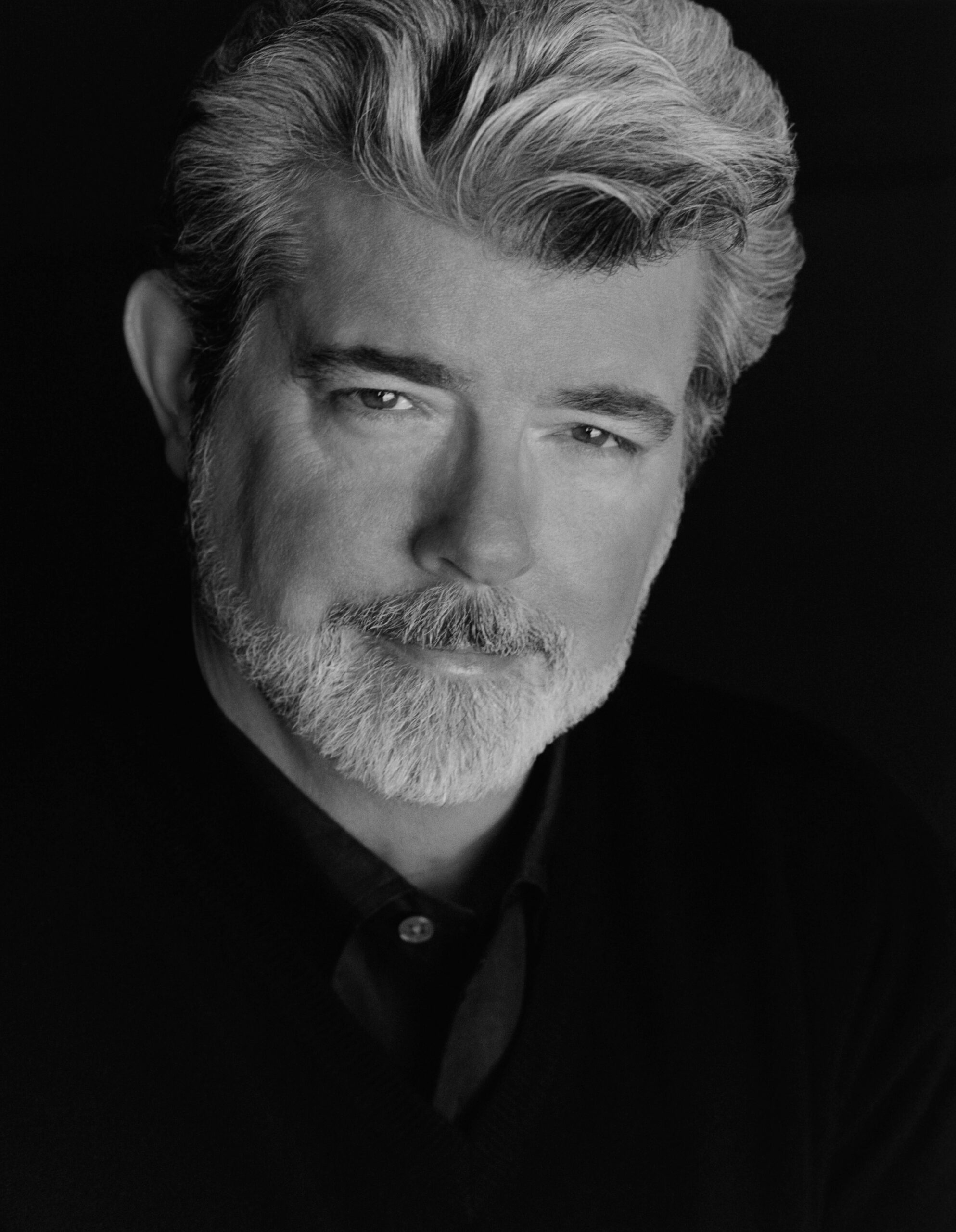 Headshot of George Lucas with a serious expression.