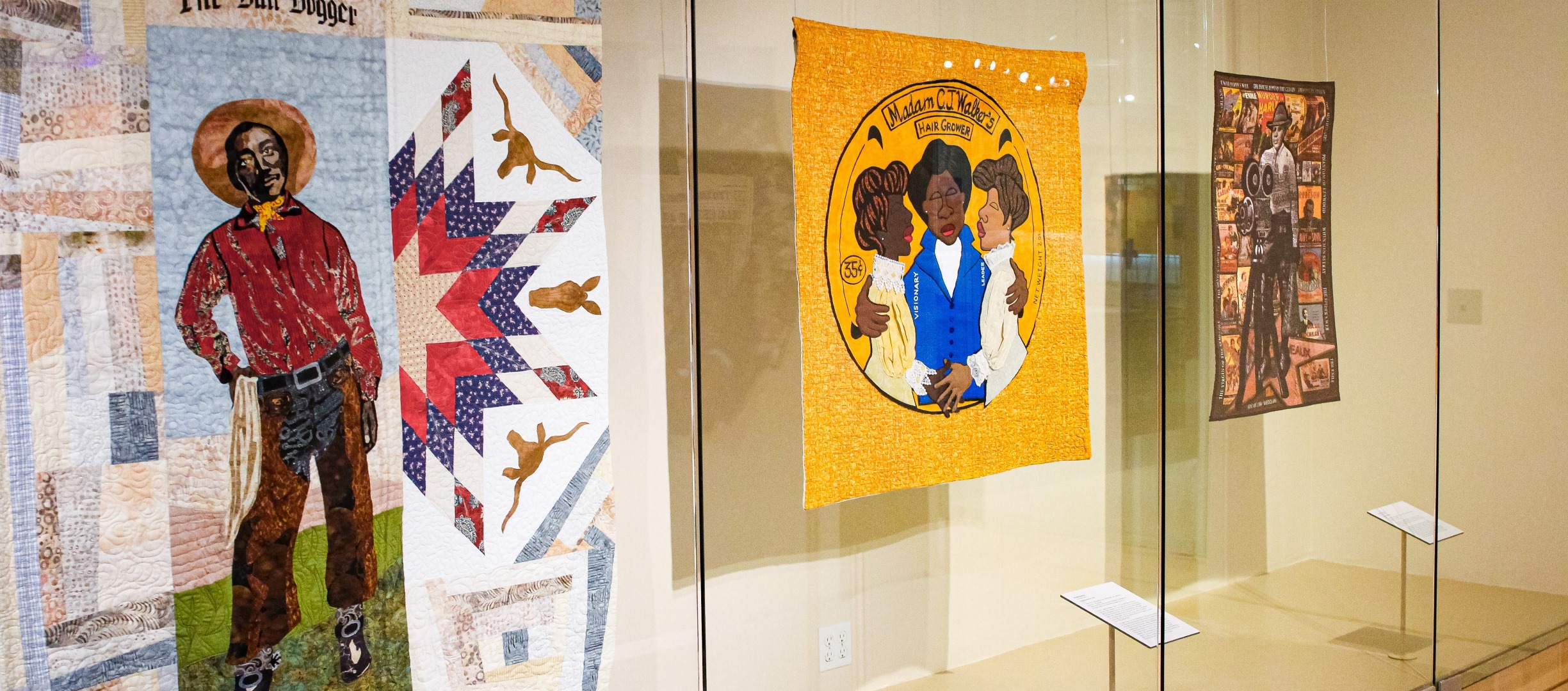 three quilts from the Black Pioneers pictorial quilt exhibit in 2023