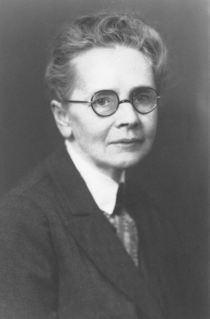 Headshot of Julia Morgan wearing glasses and a suit jacket.