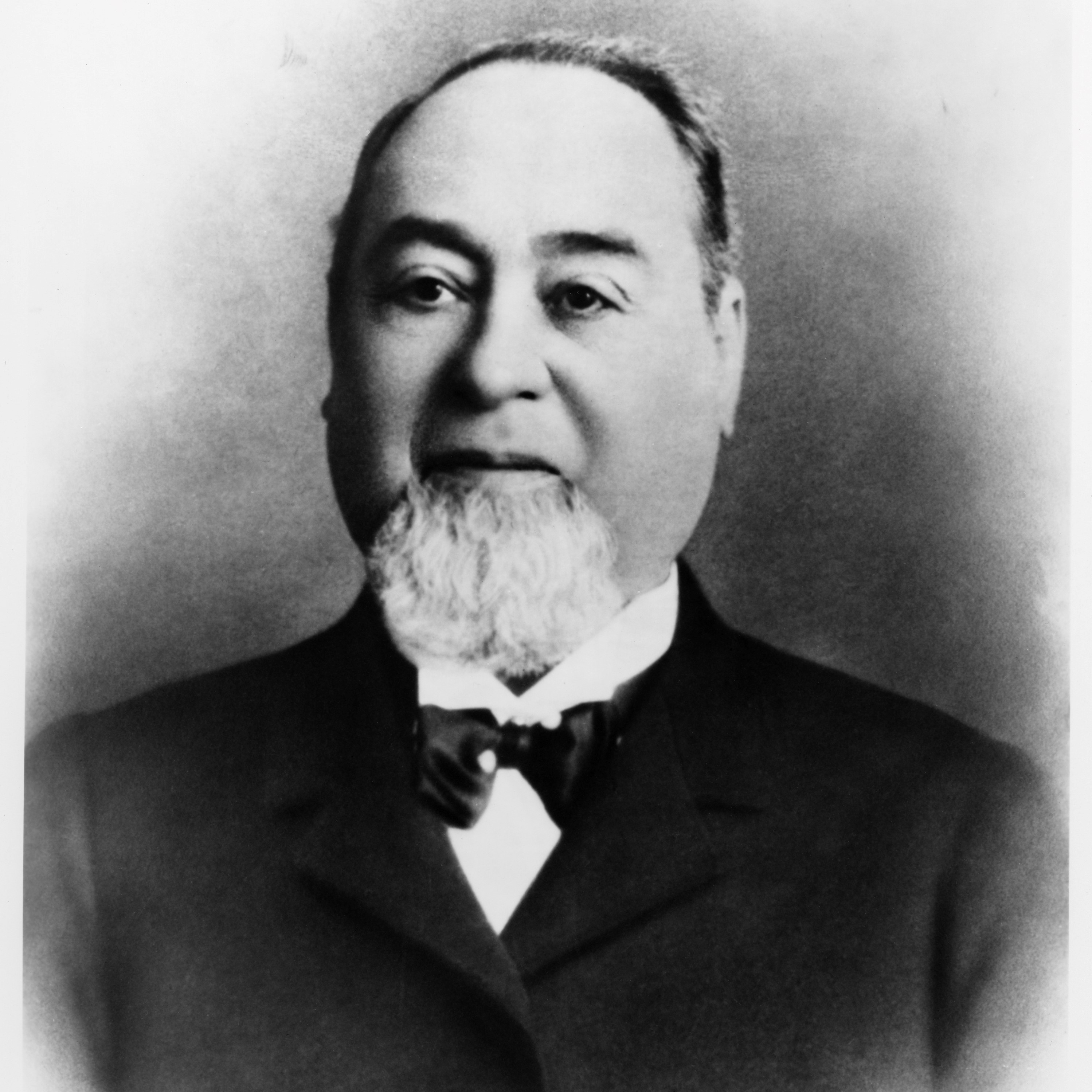 Headshot of Levi Strauss in a tuxedo.