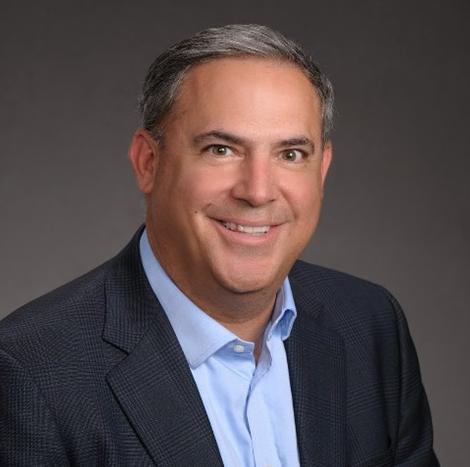 Headshot of a smiling Andrew Baldonado.