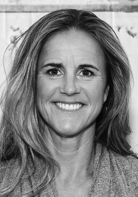 Headshot of a dressed-up Brandi Chastain.