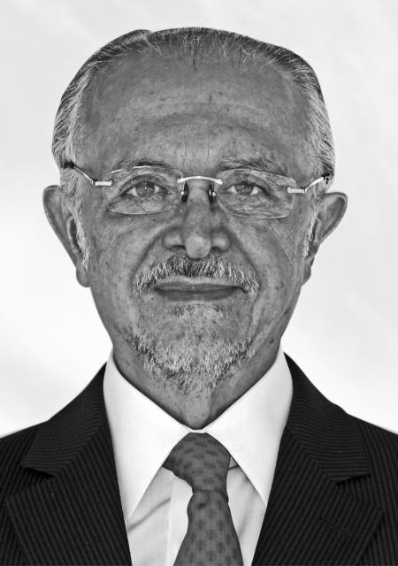 Headshot of Mario J. Molina wearing a suit, tie and glasses.