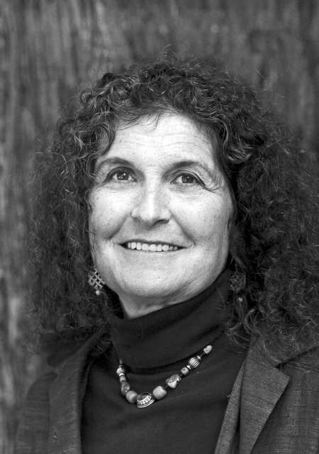 Headshot of a curly-haired Arlene Blum.