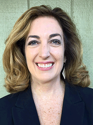 Headshot of a smiling Jackie Kinney.