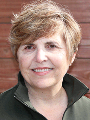 Headshot of a smiling Jami Goldstene.