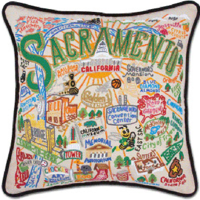 A pillow featuring Sacramento landmarks and the city name Sacramento.