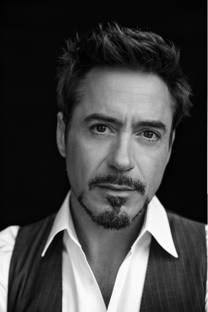 Headshot of Robert Downey Junior with a soft gaze and goatee. 