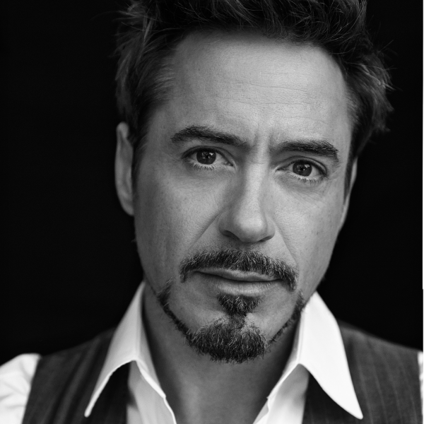 Headshot of Robert Downey Junior with a soft gaze and goatee.